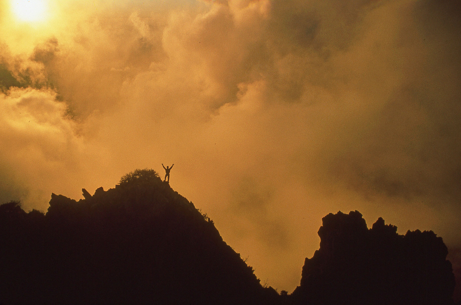 Climber, sunlight and storm, Mazatzal Mountains Wilderness, John Annerino, AZ