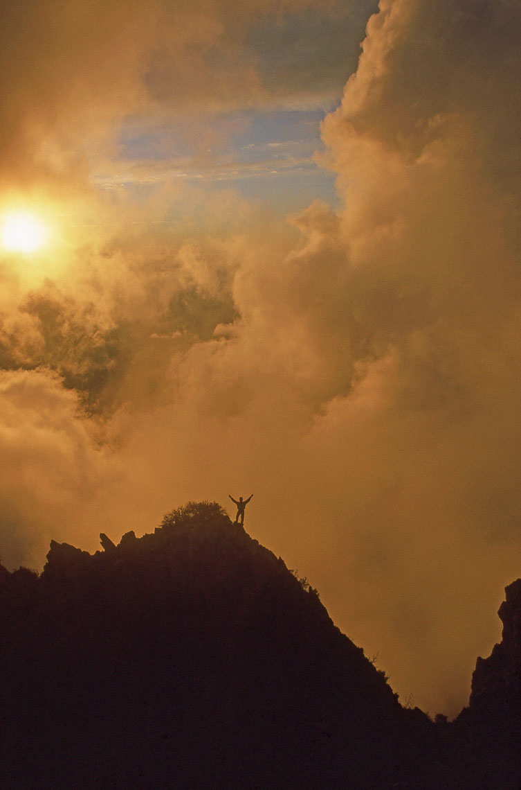 Climber, sunlight and storm, Mazatzal Mountains Wilderness, John Annerino, AZ