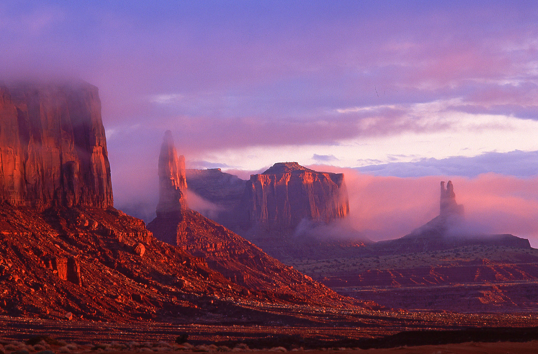 Ground fog sunrise, John Annerino. Monument Valley Navajo Tribal Park, Utah-Arizona
