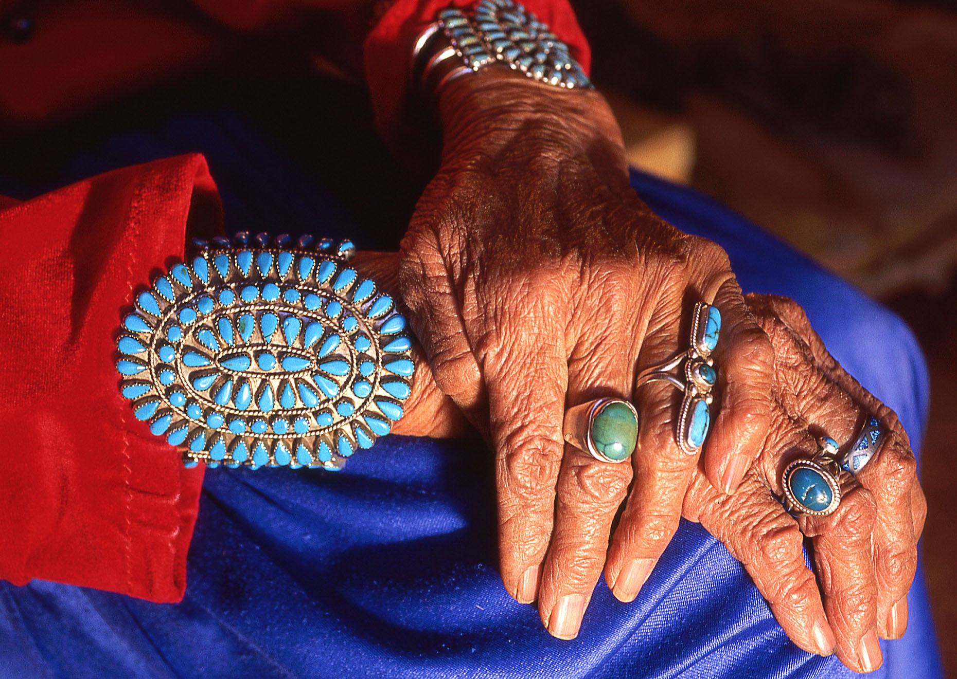 Jeweled hands of weaver and sheep herder Suzie Yazzie, John Annerino, Native American traditions, Rain God Mesa, Monument Valley Navajo Tribal Park, Arizona-Utah